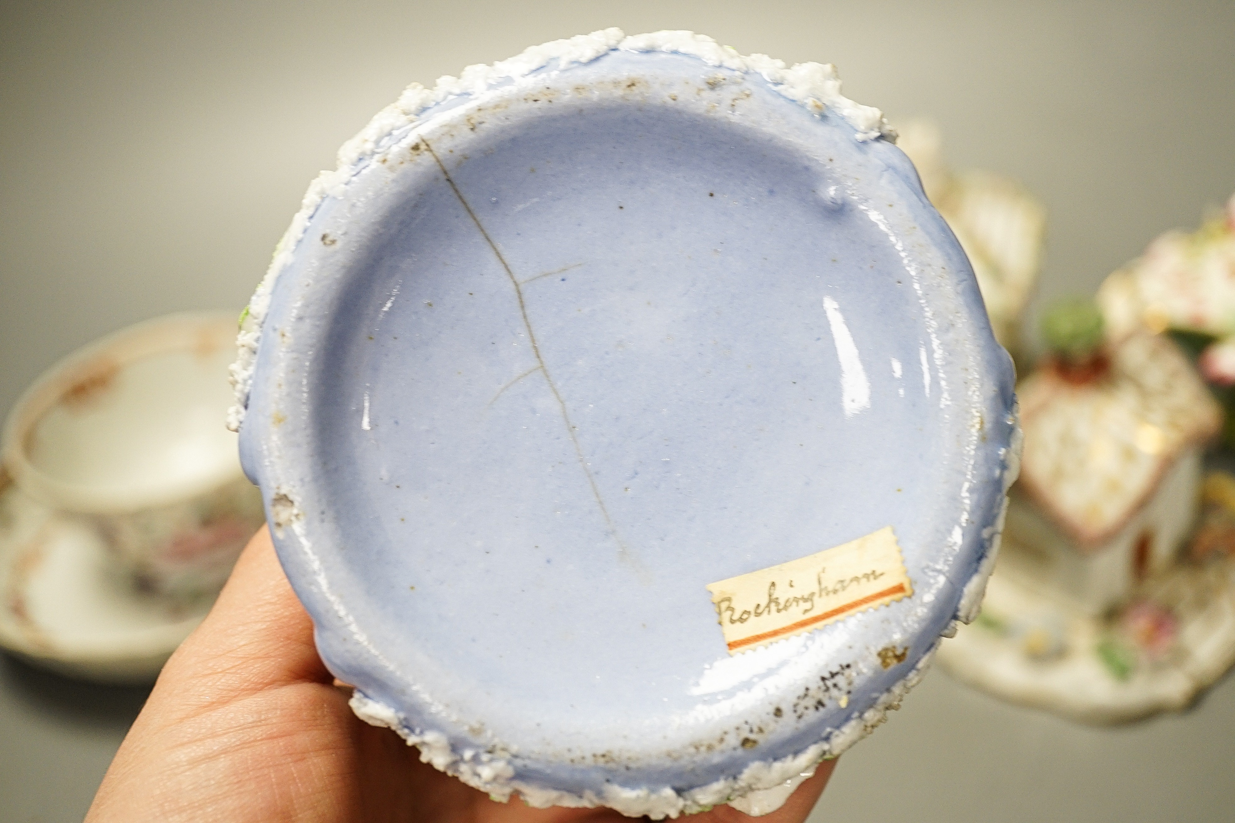 Three Chinese export famille rose tea bowls and two saucers, three Staffordshire porcelain cottage pastille burners and an English porcelain cream boat